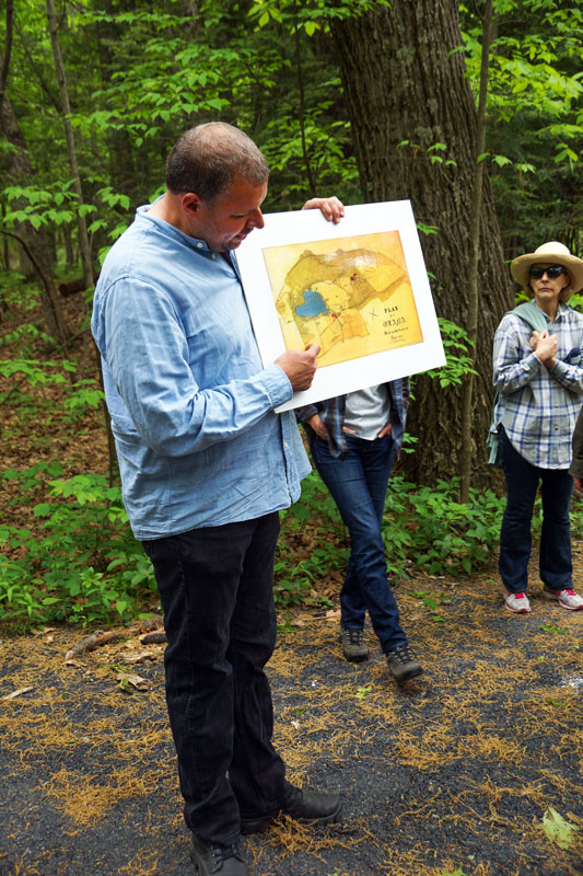 Landscape Curator Mark Prezorski uses the 1886 Plan of Olana to explain to visitors the restoration of Crown Hill. May 2013. Photo by Annik LaFarge, author of Composing Olana