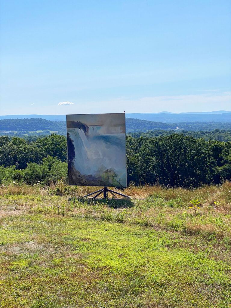 One of Diana Wege's "Niagara" paintings with a bird perched on the edge. Photo by Annik LaFarge, author of Composing Olana