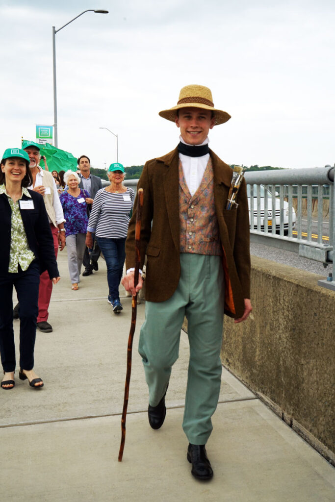 A Thomas Cole lookalike walks across the Skywalk during the 