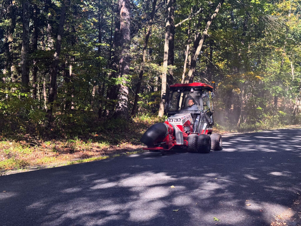 In autumn the NYS Parks staff uses a machine to clear the roads of fallen leaves. Photo by Annik LaFarge, author of Composing Olana