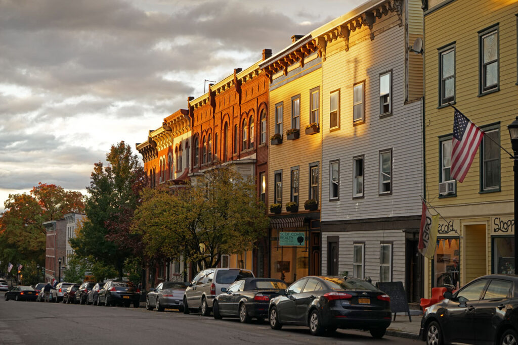 Warren Street, Hudson, October 2014. "There is a mythic romantic quality to Hudson that’s hard to define. Even now, as the city appears more civilized than ever, it retains its ungovernable spirit just below the surface. According to the Hudson Wail, “the cracks in the sidewalks aren’t the flaw, they’re the story.” -- Jamie Larson, Chronogram, 9-1-2025. Photo by Annik LaFarge, author of Composing Olana