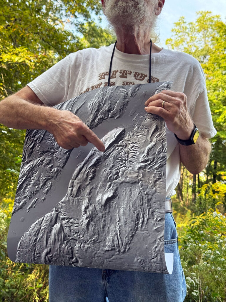 Catskill Geologist Robert Titus points to Mt. Merino, a rock drumlin, on his LiDAR topographic map. Photo by Annik LaFarge, author of Composing Olana