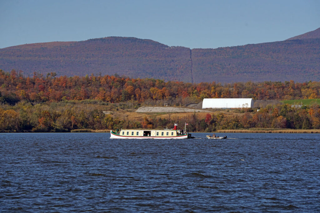 Replica of the Seneca Chief passes the Catskill Mountain House site on a historic voyage from Buffalo to NYC in observance of the 200th anniversary of the opening of the Erie Canal. Photo by Annik LaFarge, author of Composing Olana